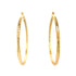 The Huge Zigzag Texturized Hoops Earrings, crafted in 14k gold-filled material, feature a bold zigzag pattern against a white background, creating a striking statement piece.